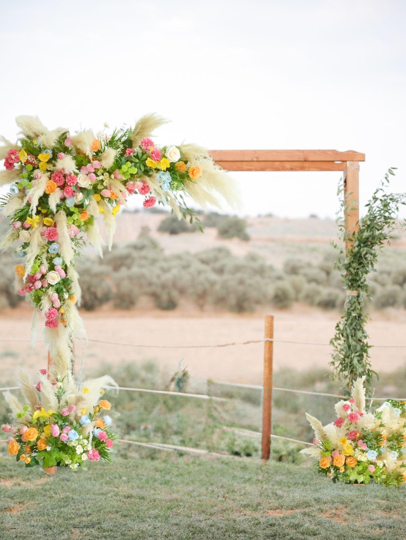 Colorful Pampas Grass Wedding Arch Flowers: Light Blue, Peach Ceremony Decor