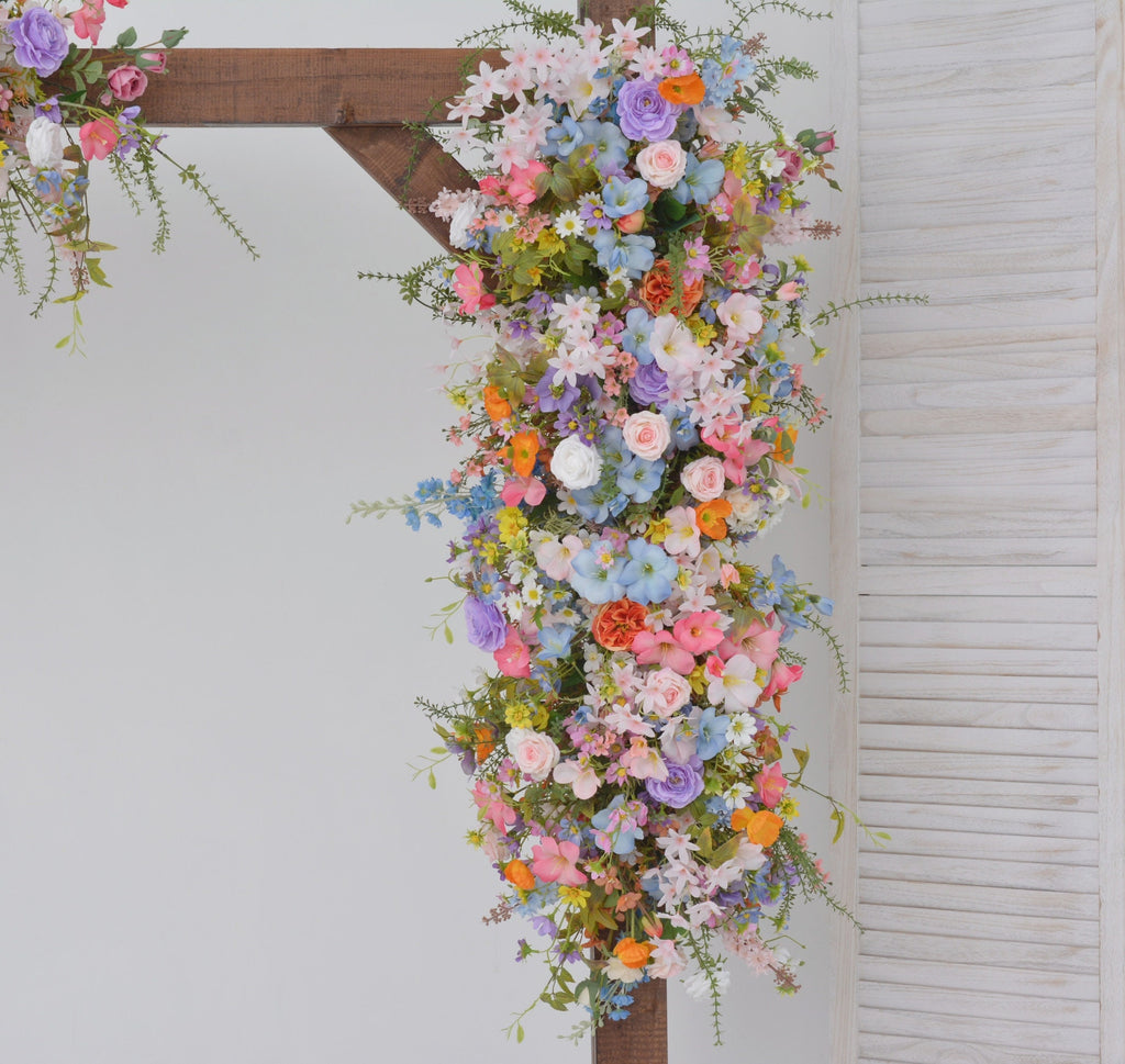 Pastel Wildflower Wedding Arbor Arrangements with Light Pink, Orange, Purple, and Blue Accents