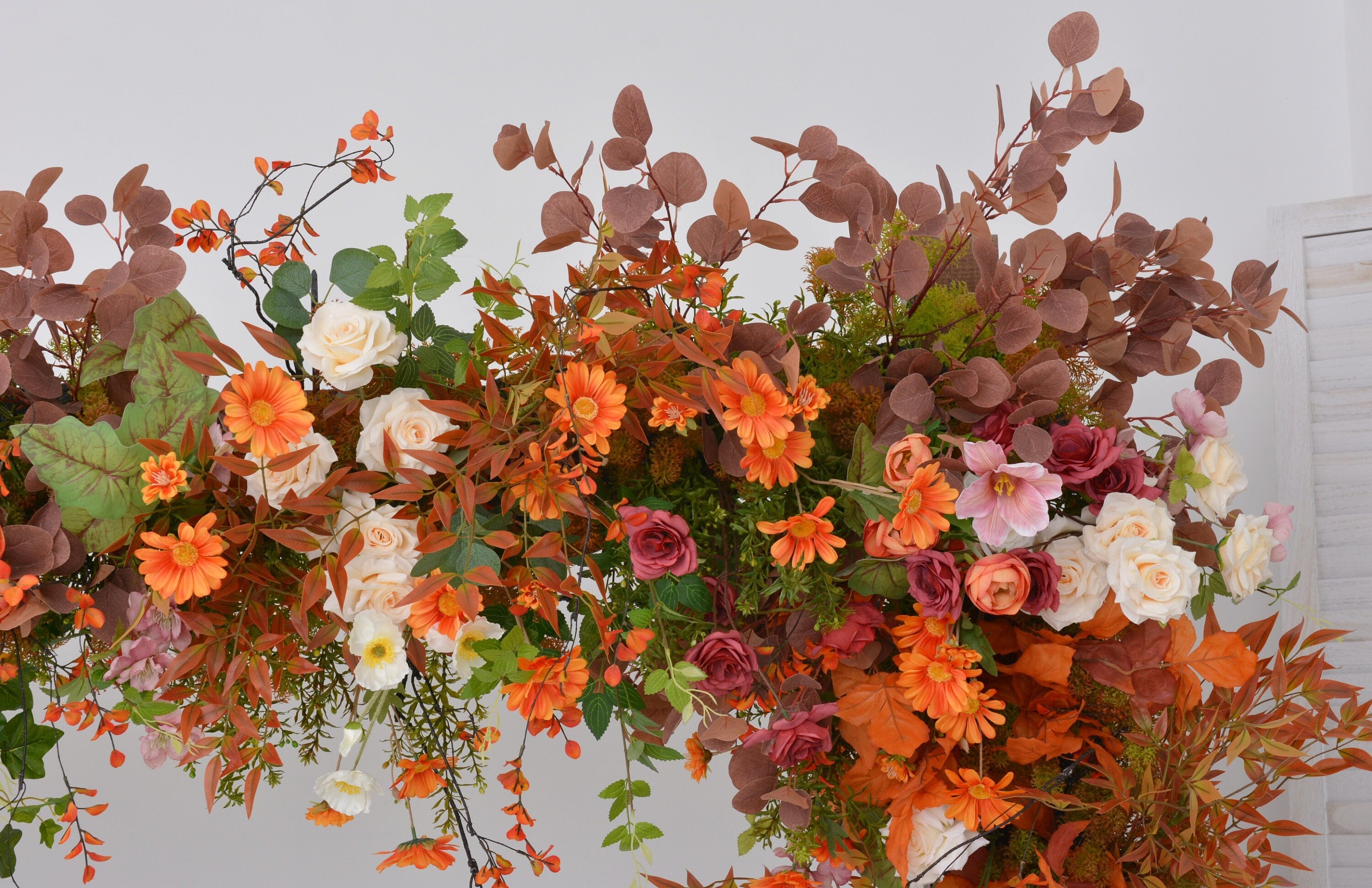 Fall Wedding Floral Arrangement with Pops of Orange, Red, and Champagne