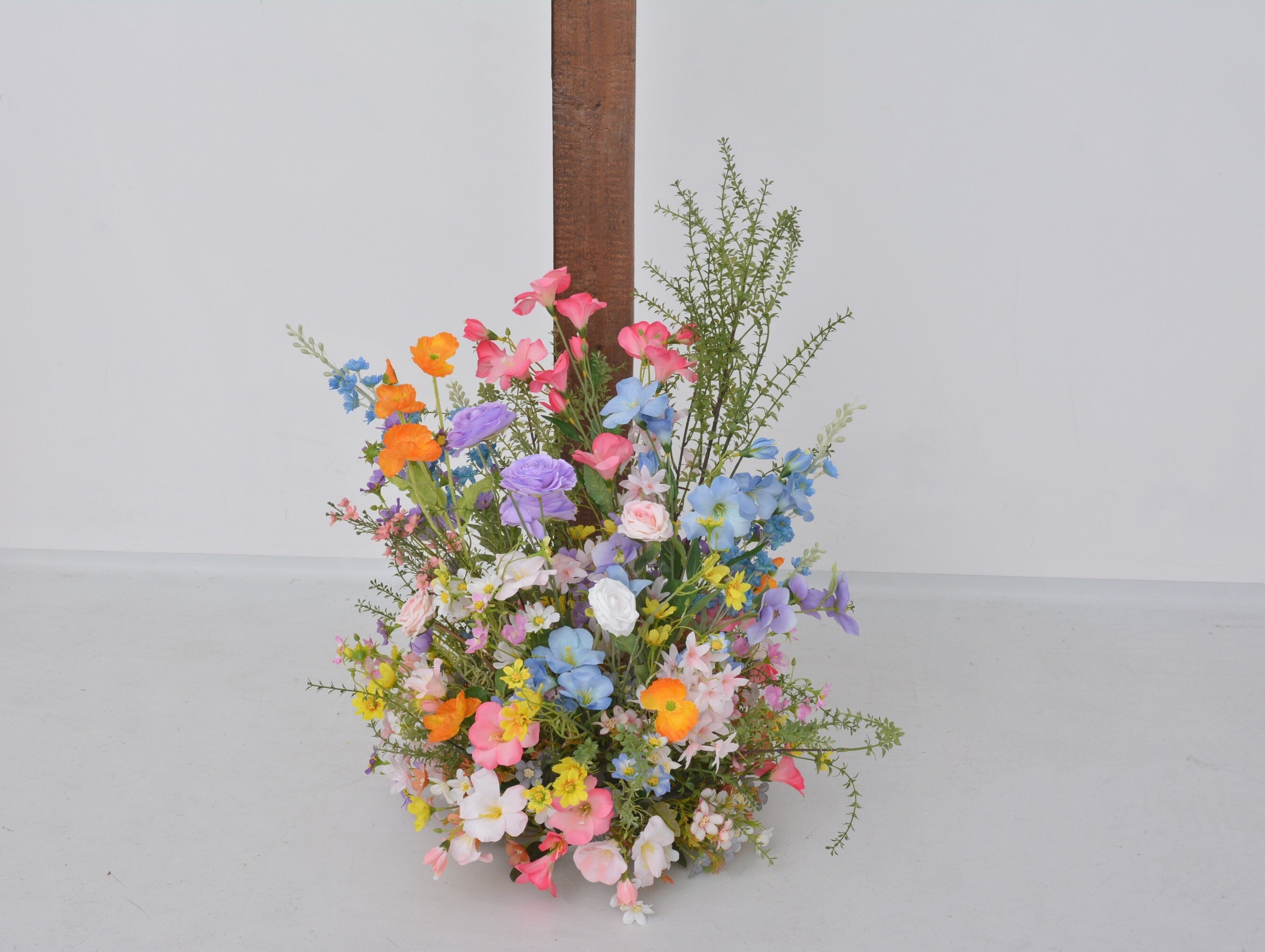 Pastel Wildflower Wedding Arbor Arrangements with Light Pink, Orange, Purple, and Blue Accents