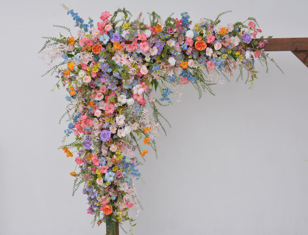 Pastel Wildflower Wedding Arbor Arrangements with Light Pink, Orange, Purple, and Blue Accents