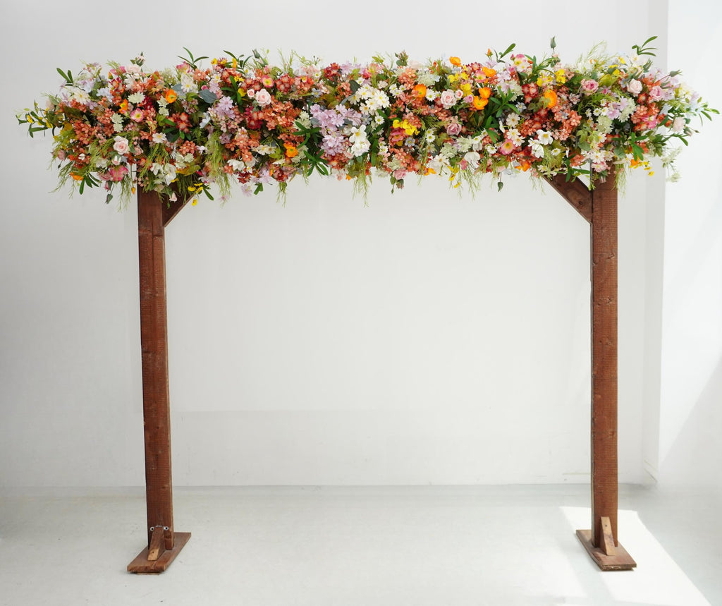 Wildflower Wedding Arbor Arrangements in Pastel Palette with a Splash of Orange and Light Blue