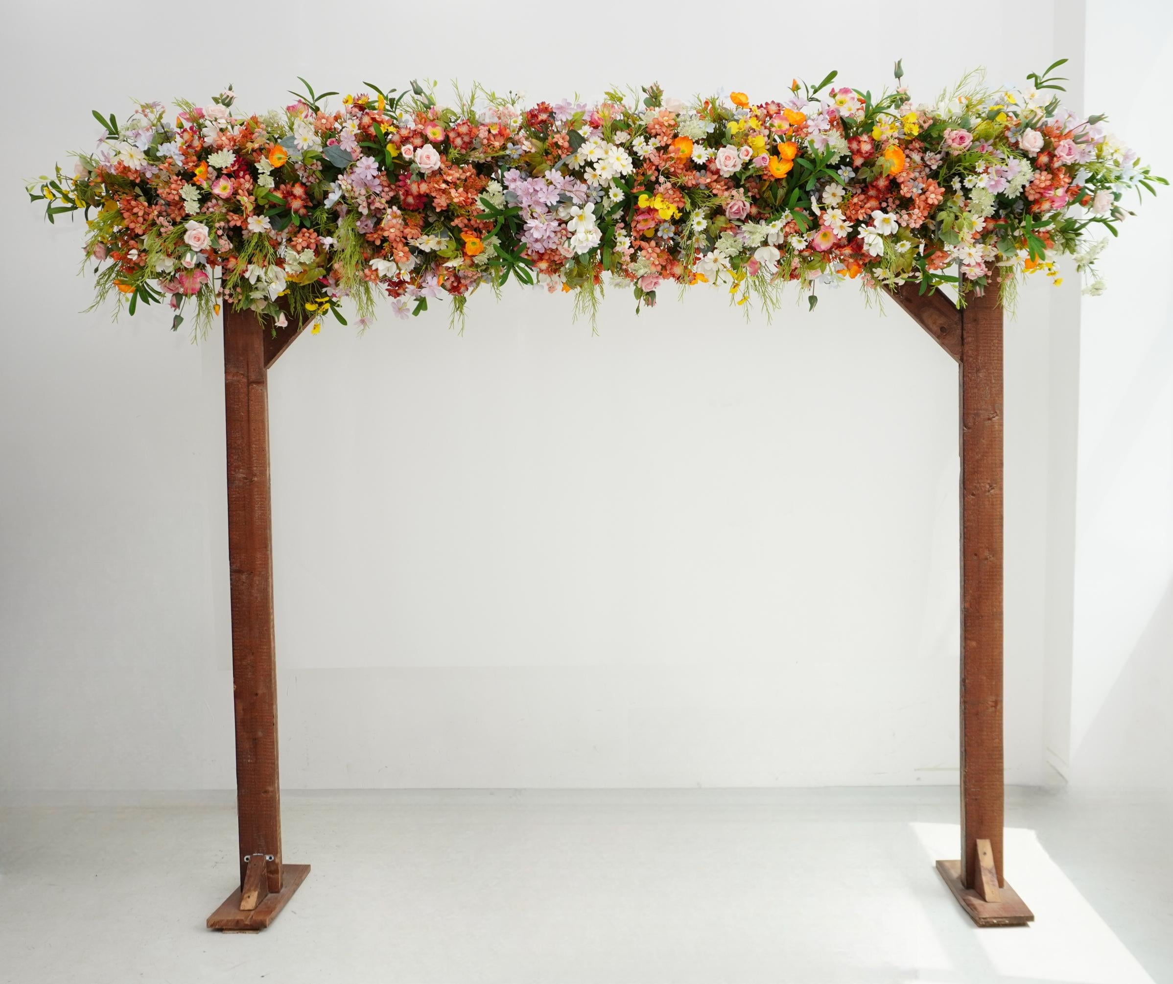 Wildflower Wedding Arbor Arrangements in Pastel Palette with a Splash of Orange and Light Blue