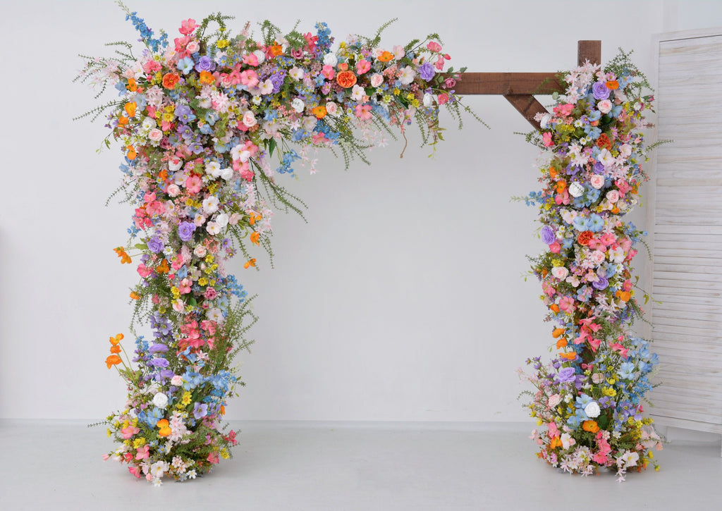 Pastel Wildflower Wedding Arbor Arrangements with Light Pink, Orange, Purple, and Blue Accents