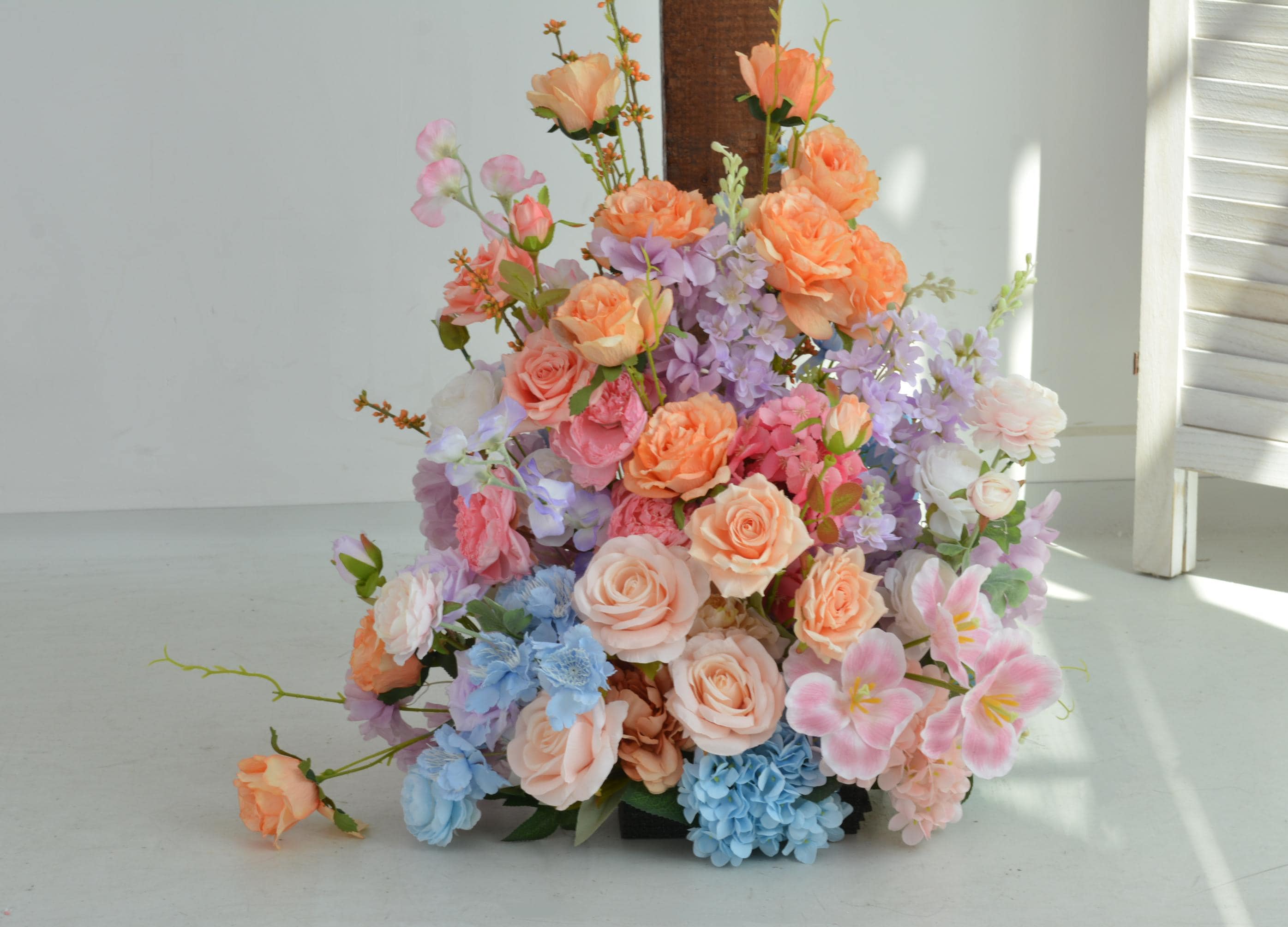 Pastel Wedding Arch Flower Arrangement with Soft Peach, Blush Pink, Baby Blue, and Lavender