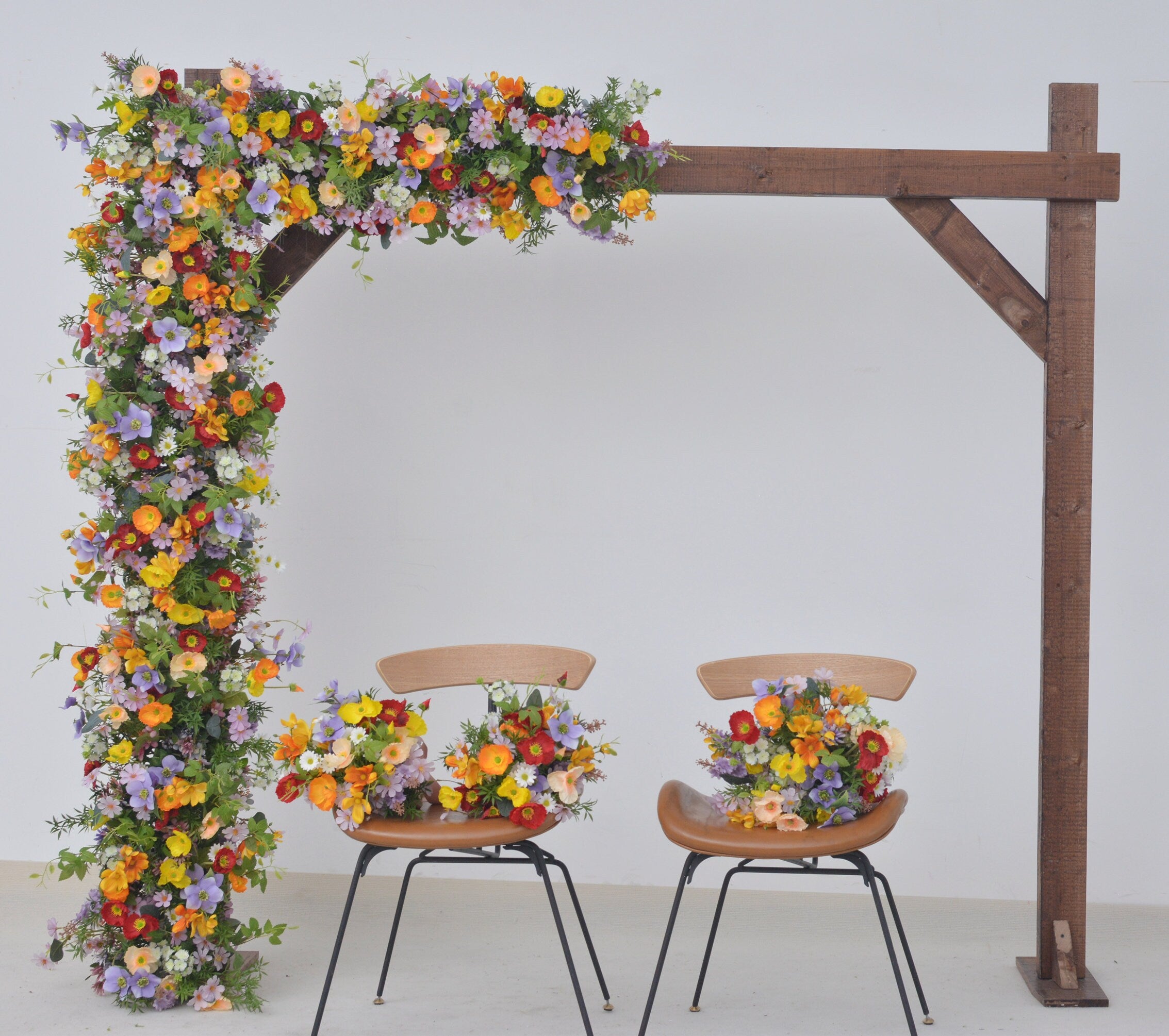 Wildflower Themed Wedding Arch Arrangements in Purple, Orange, Red and Yellow