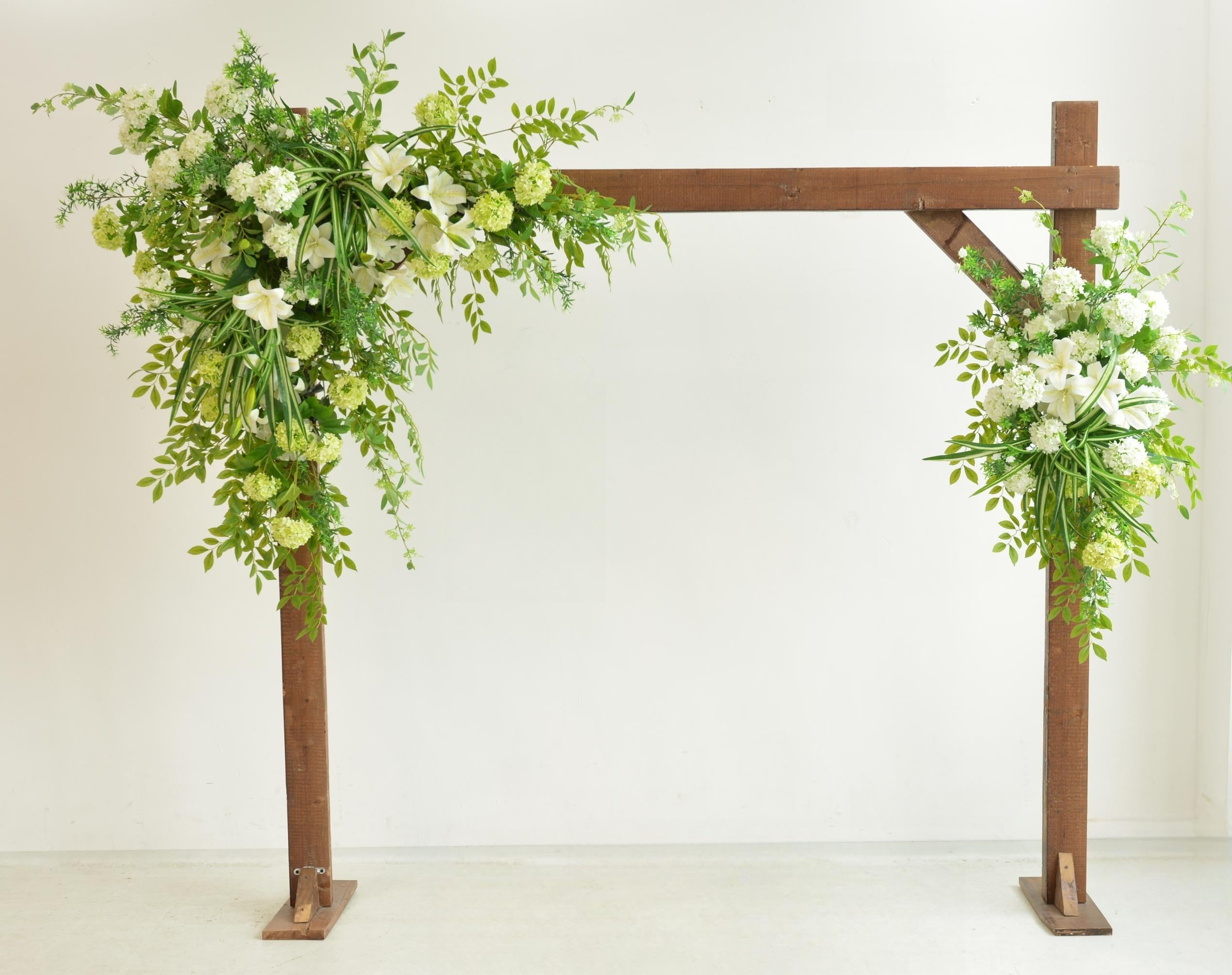 Elegant Wedding Arch with White and Green Floral Arrangement