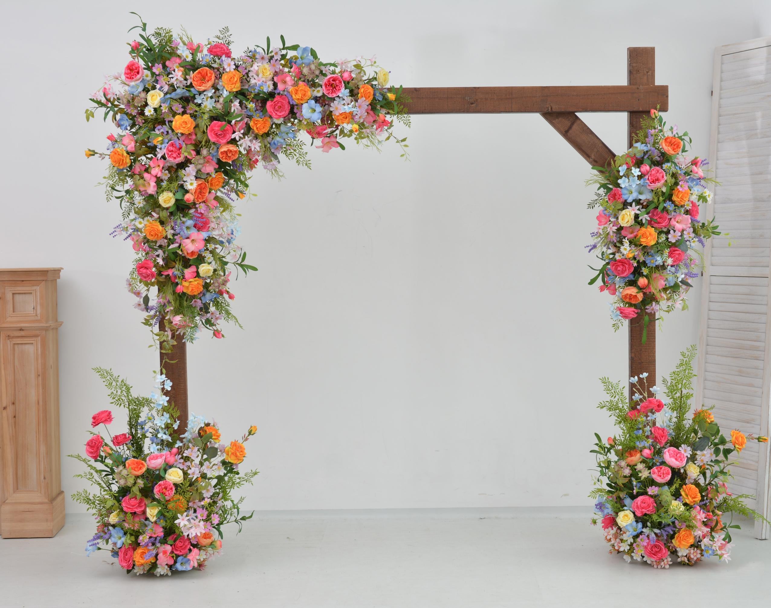 Arch Wildflowers Floral Arrangement with Hot Pink, Light Blue, Orange, and Pale Purple