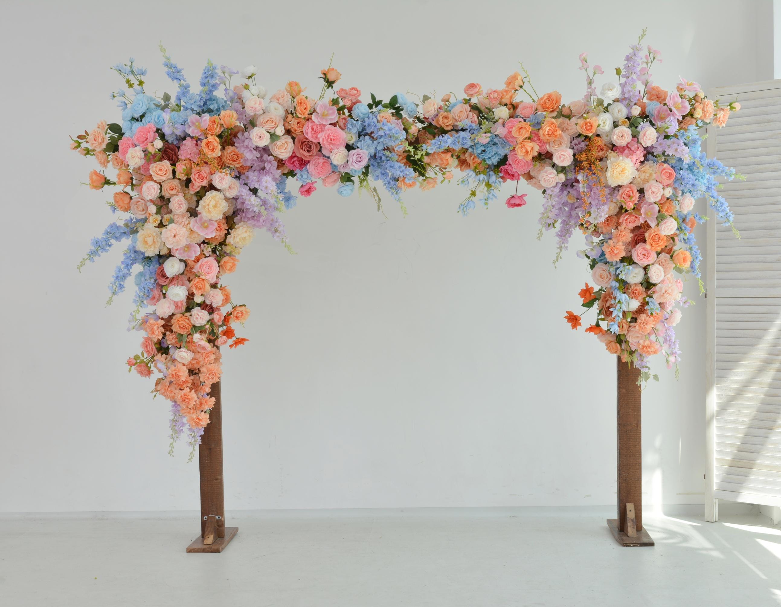 Pastel Wedding Arch Flower Arrangement with Soft Peach, Blush Pink, Baby Blue, and Lavender