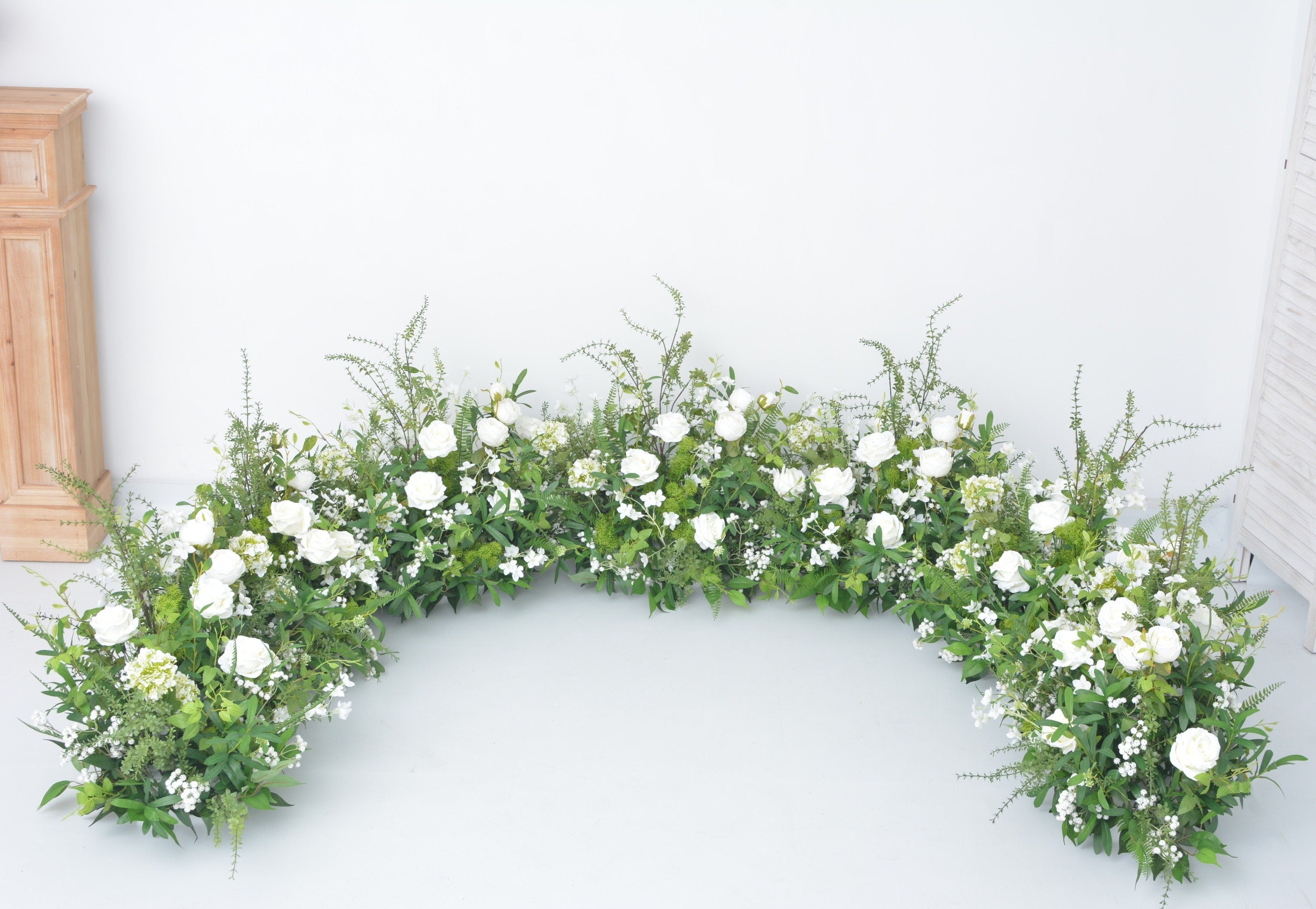 Grounded Arch Arrangements with Greenery and White Flowers