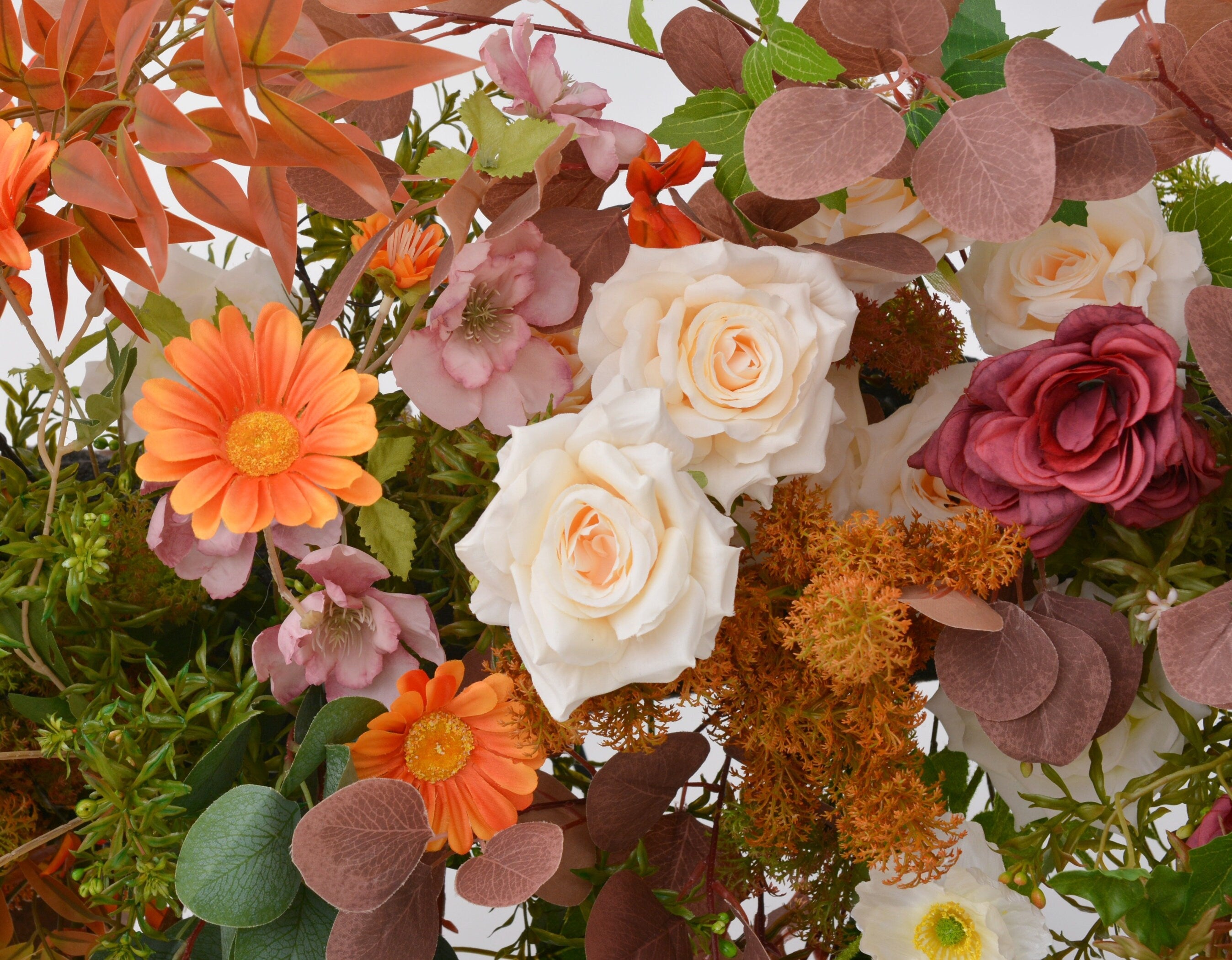 Fall Wedding Floral Arrangement with Pops of Orange, Red, and Champagne