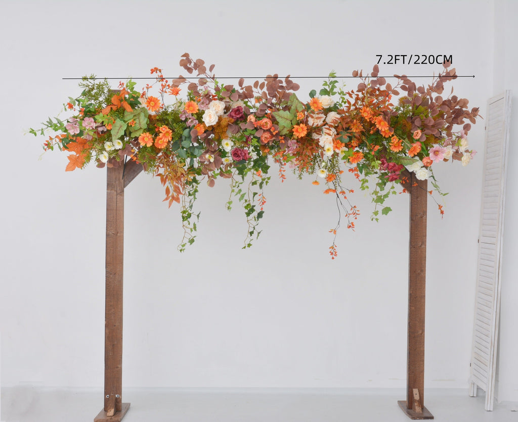 Fall Wedding Floral Arrangement with Pops of Orange, Red, and Champagne