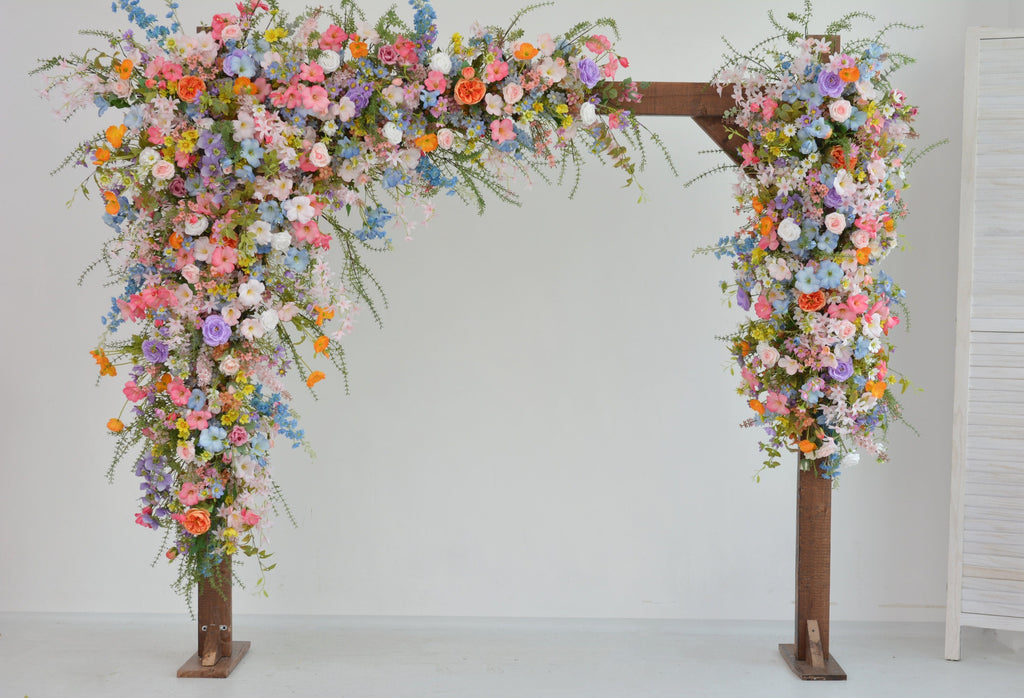 Pastel Wildflower Wedding Arbor Arrangements with Light Pink, Orange, Purple, and Blue Accents