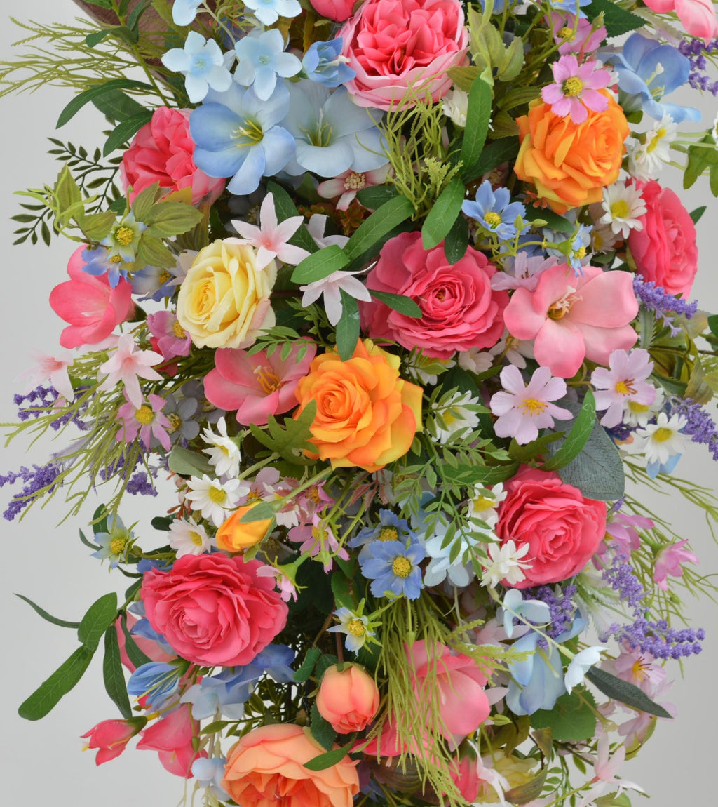 Arch Wildflowers Floral Arrangement with Hot Pink, Light Blue, Orange, and Pale Purple
