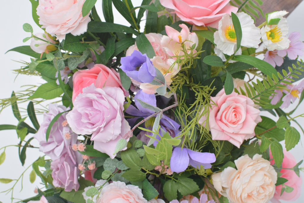 Artificial Wedding Arch Arrangements with Flowers in Shades of Pink, Purple and Champagne