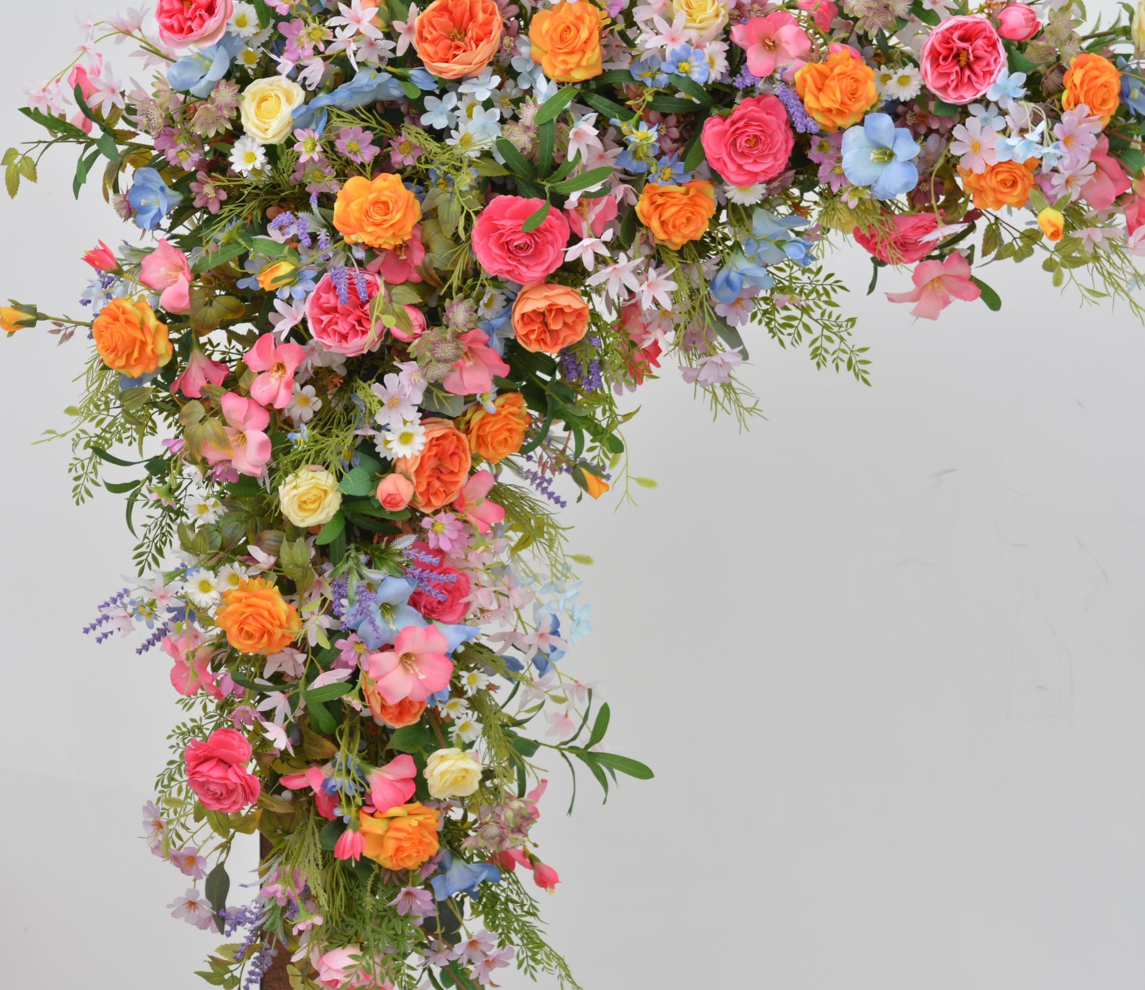 Arch Wildflowers Floral Arrangement with Hot Pink, Light Blue, Orange, and Pale Purple
