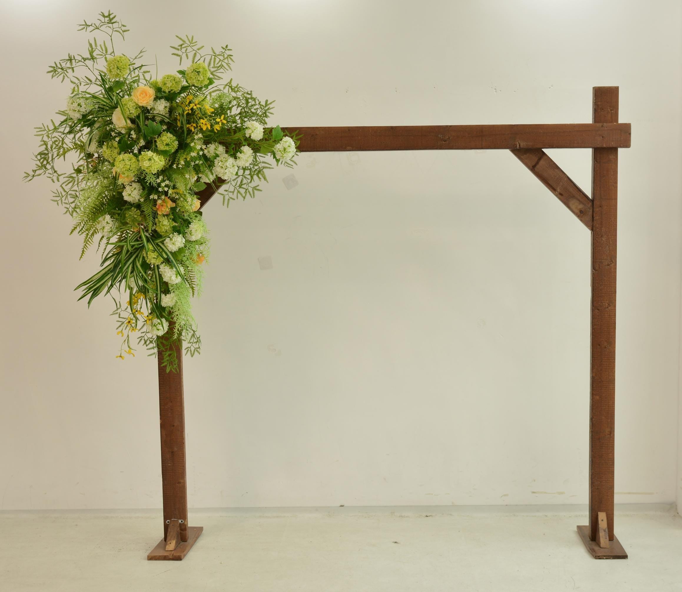 Greenery Wedding Arch Arrangement in Shades of Green, White, Champagne, and Yellow