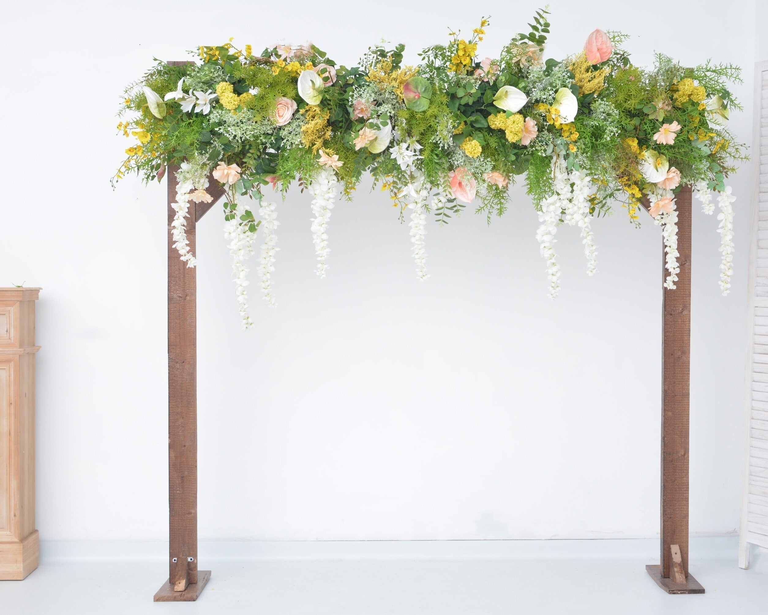 Lush Greenery Wedding Arch Arrangement with Champagne, Yellow, and White Flowers