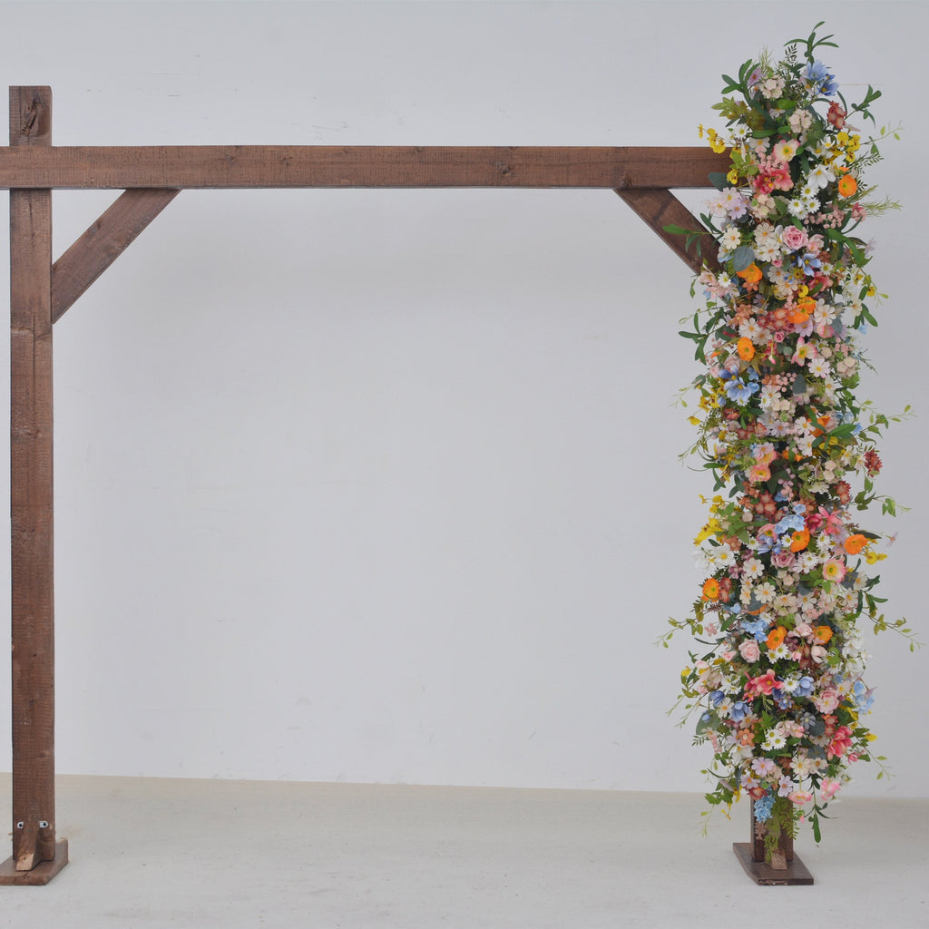 Wildflower Wedding Arbor Arrangements in Pastel Palette with a Splash of Orange and Light Blue