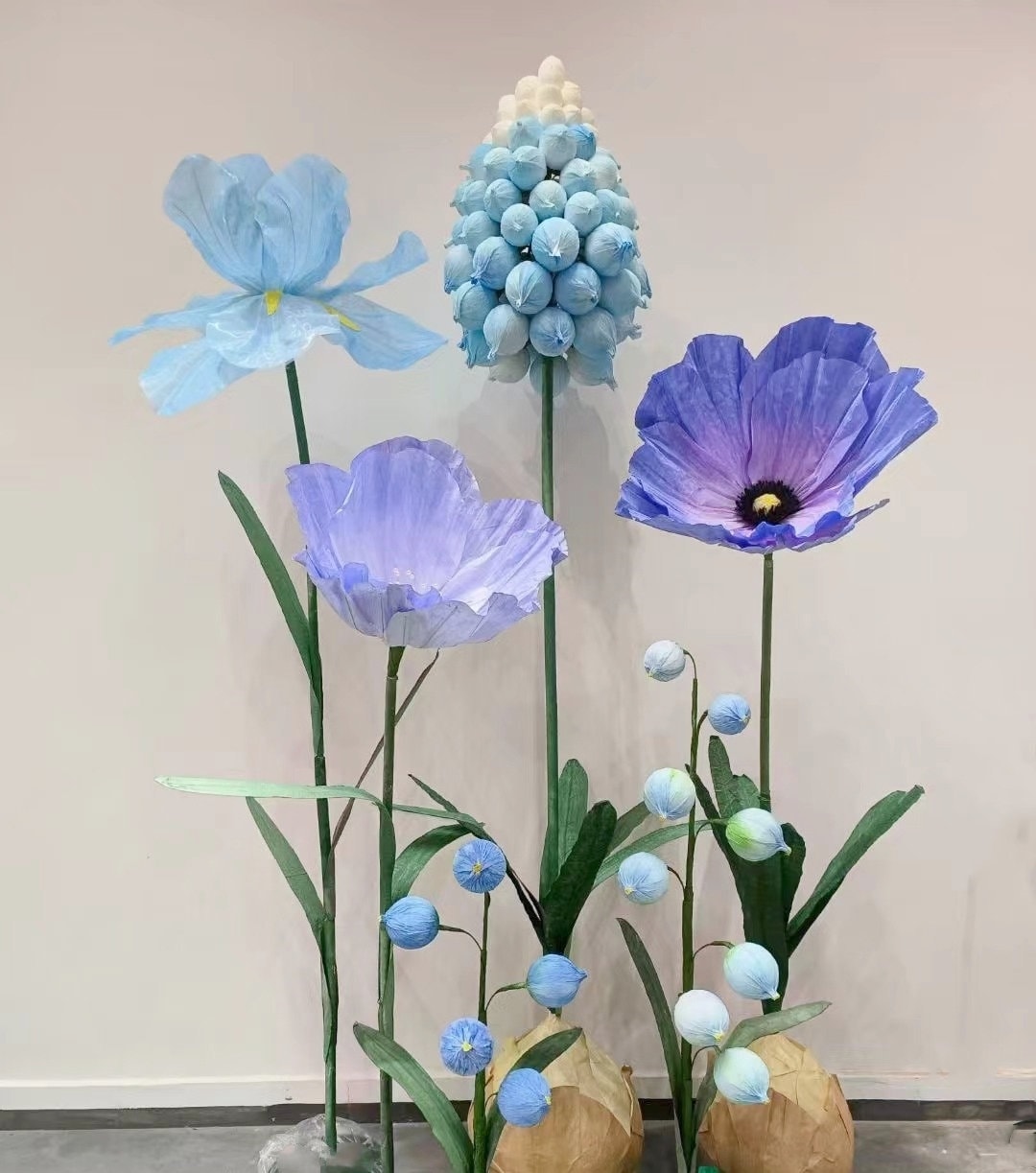 Giant Freestanding Flowers in Paper, Silk, and EVA for Window Displays and Event Decor