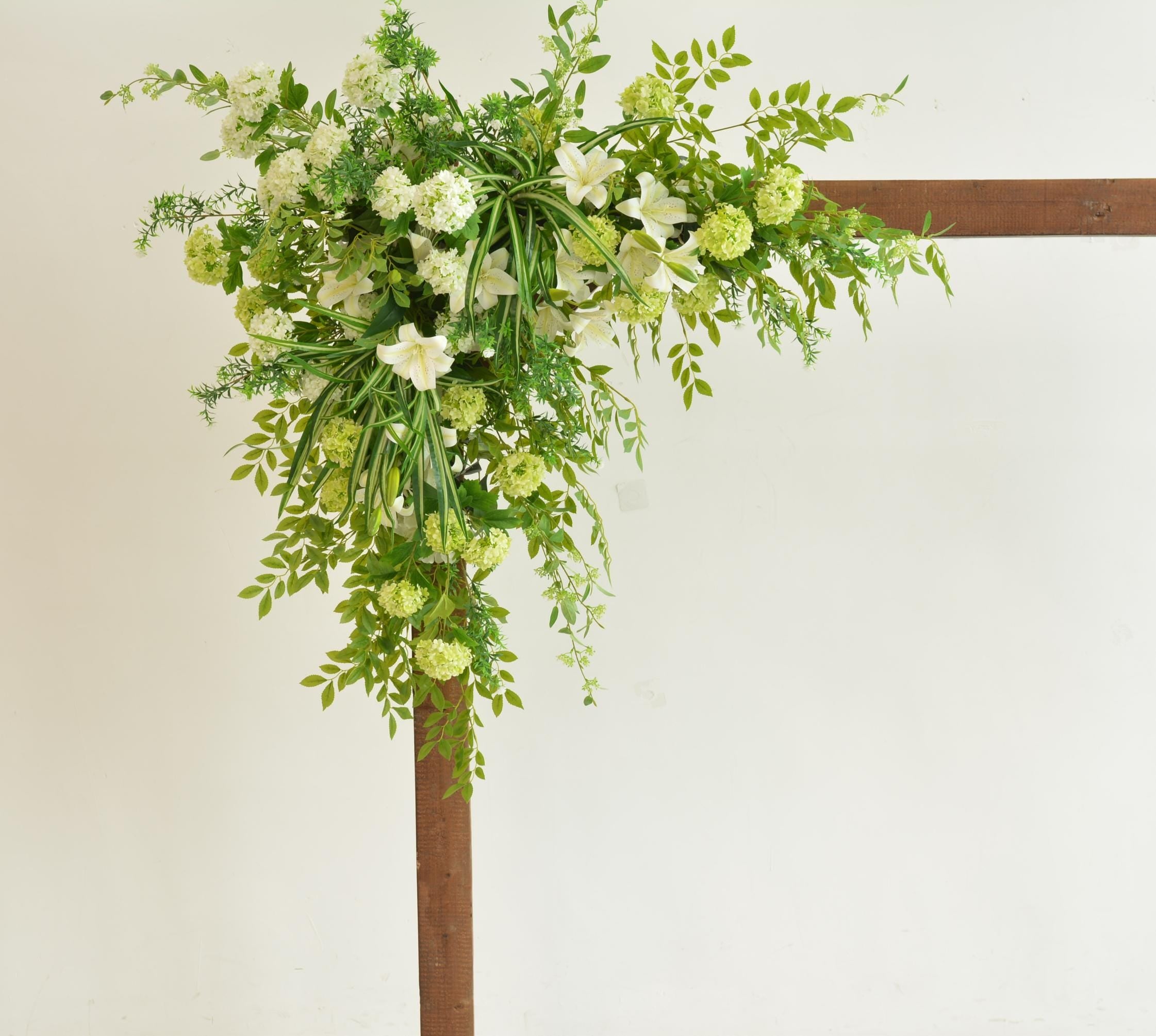 Elegant Wedding Arch with White and Green Floral Arrangement