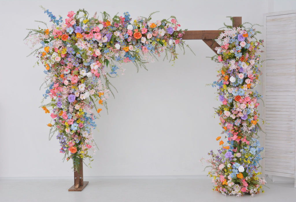 Pastel Wildflower Wedding Arbor Arrangements with Light Pink, Orange, Purple, and Blue Accents