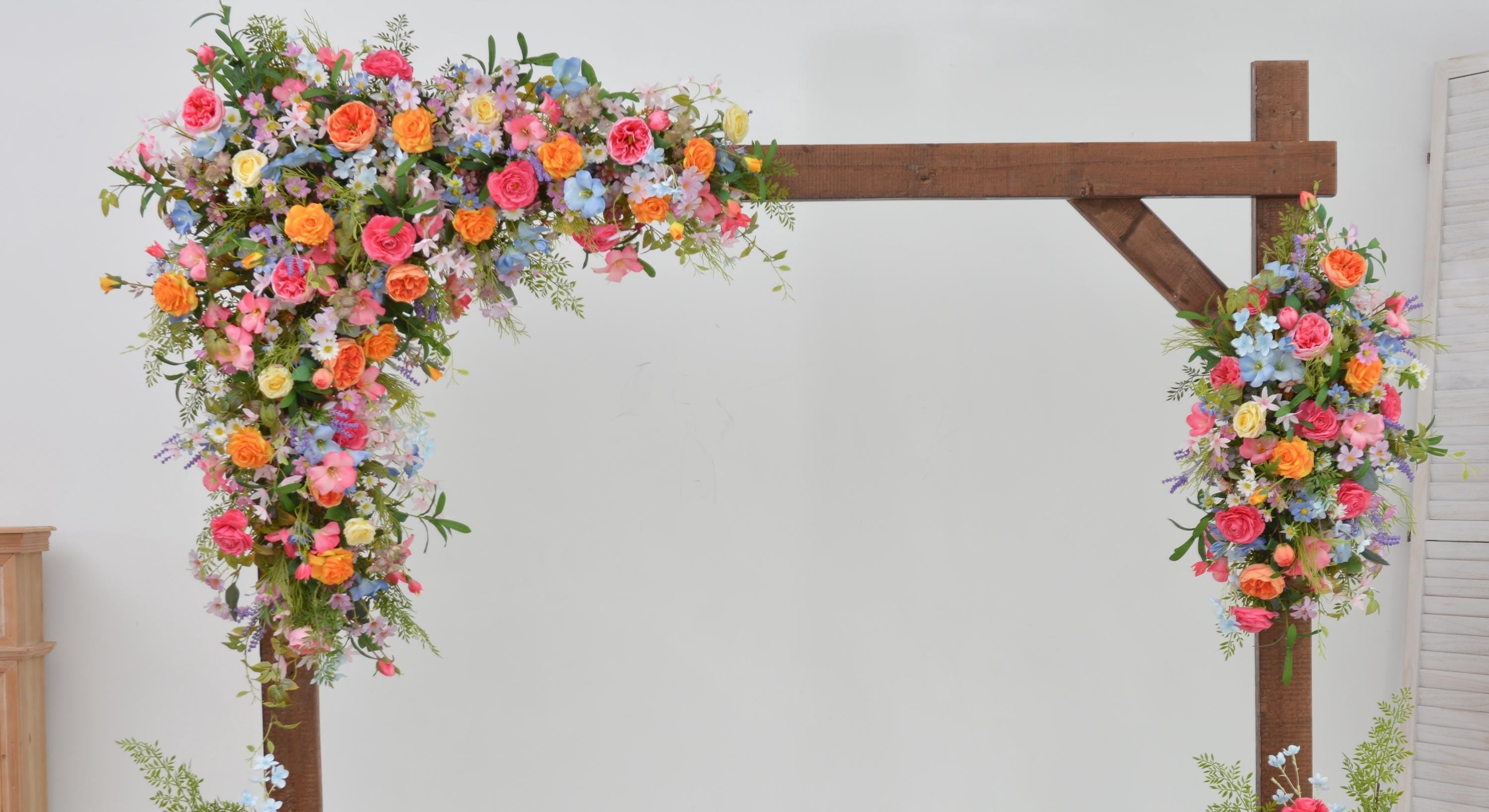 Arch Wildflowers Floral Arrangement with Hot Pink, Light Blue, Orange, and Pale Purple