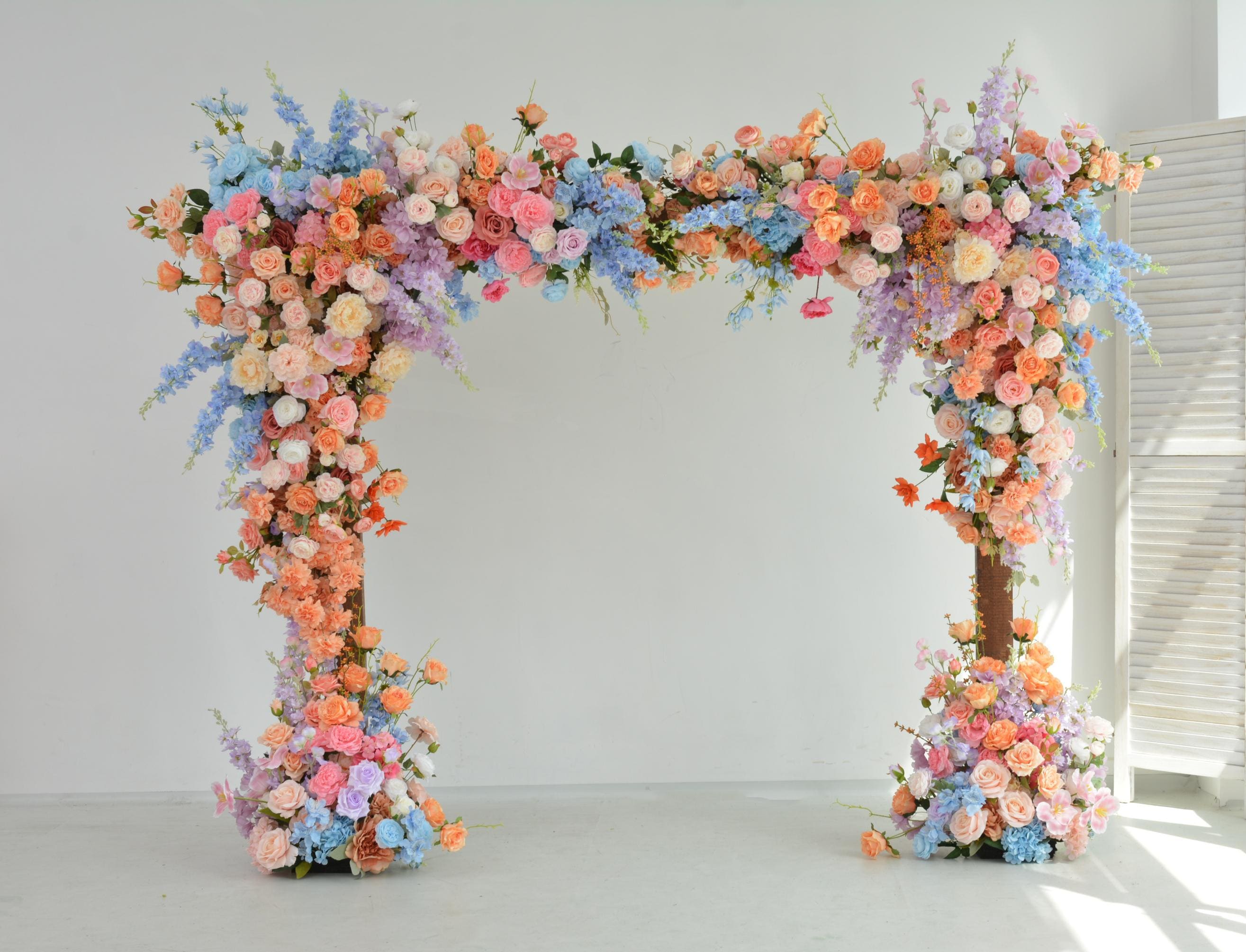 Pastel Wedding Arch Flower Arrangement with Soft Peach, Blush Pink, Baby Blue, and Lavender