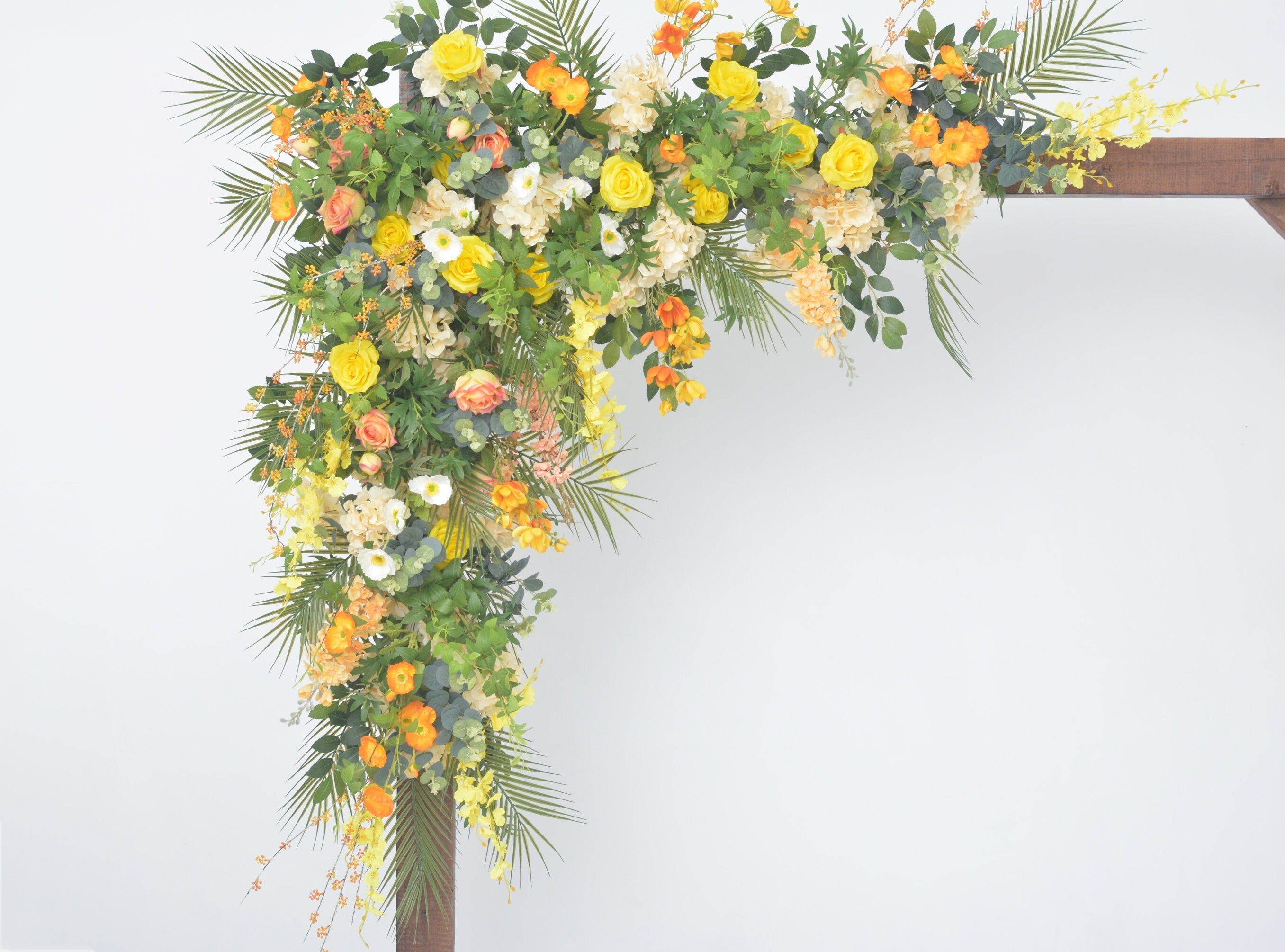 Lush Greenery Wedding Arch Decor with Yellow, Orange, and Champagne Floral Accents