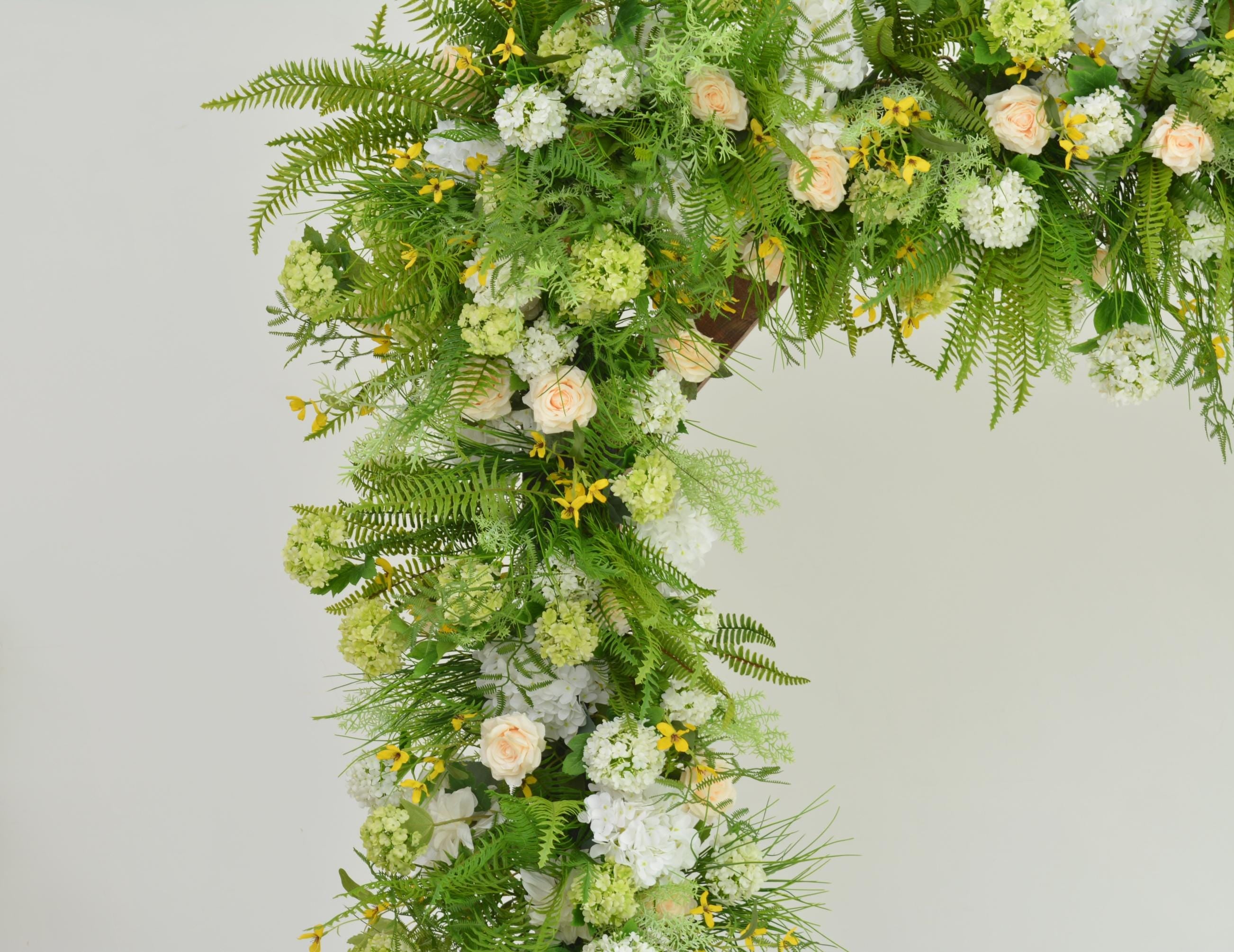 Greenery Wedding Arch Arrangement in Shades of Green, White, Champagne, and Yellow