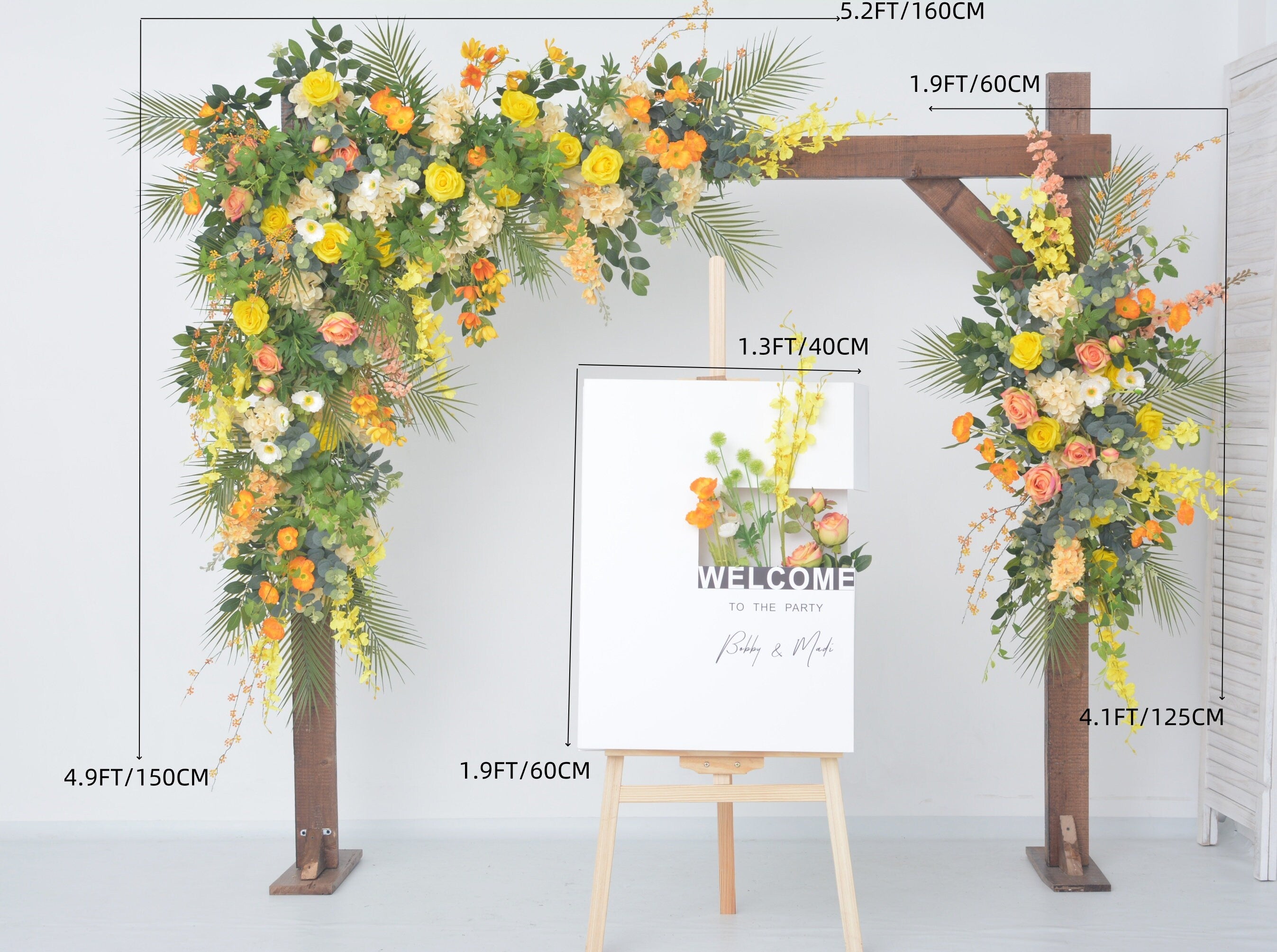 Lush Greenery Wedding Arch Decor with Yellow, Orange, and Champagne Floral Accents
