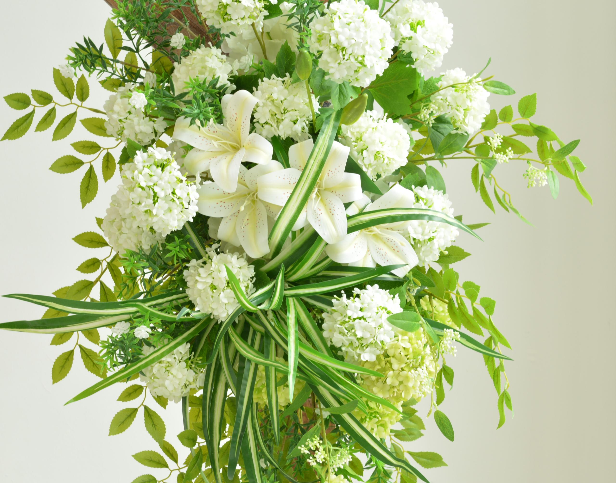 Elegant Wedding Arch with White and Green Floral Arrangement