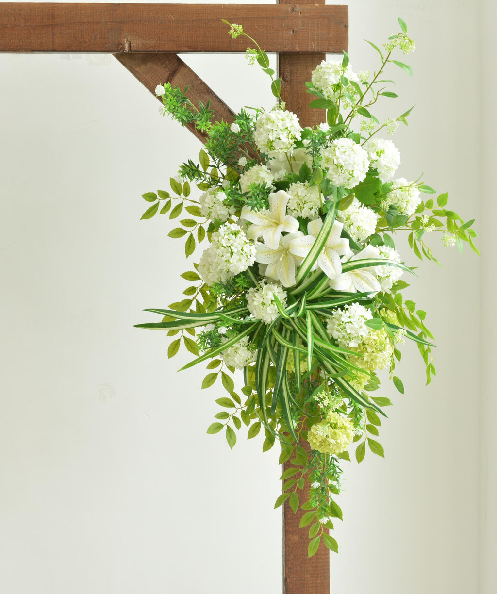 Elegant Wedding Arch with White and Green Floral Arrangement