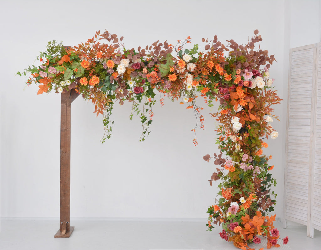Fall Wedding Floral Arrangement with Pops of Orange, Red, and Champagne