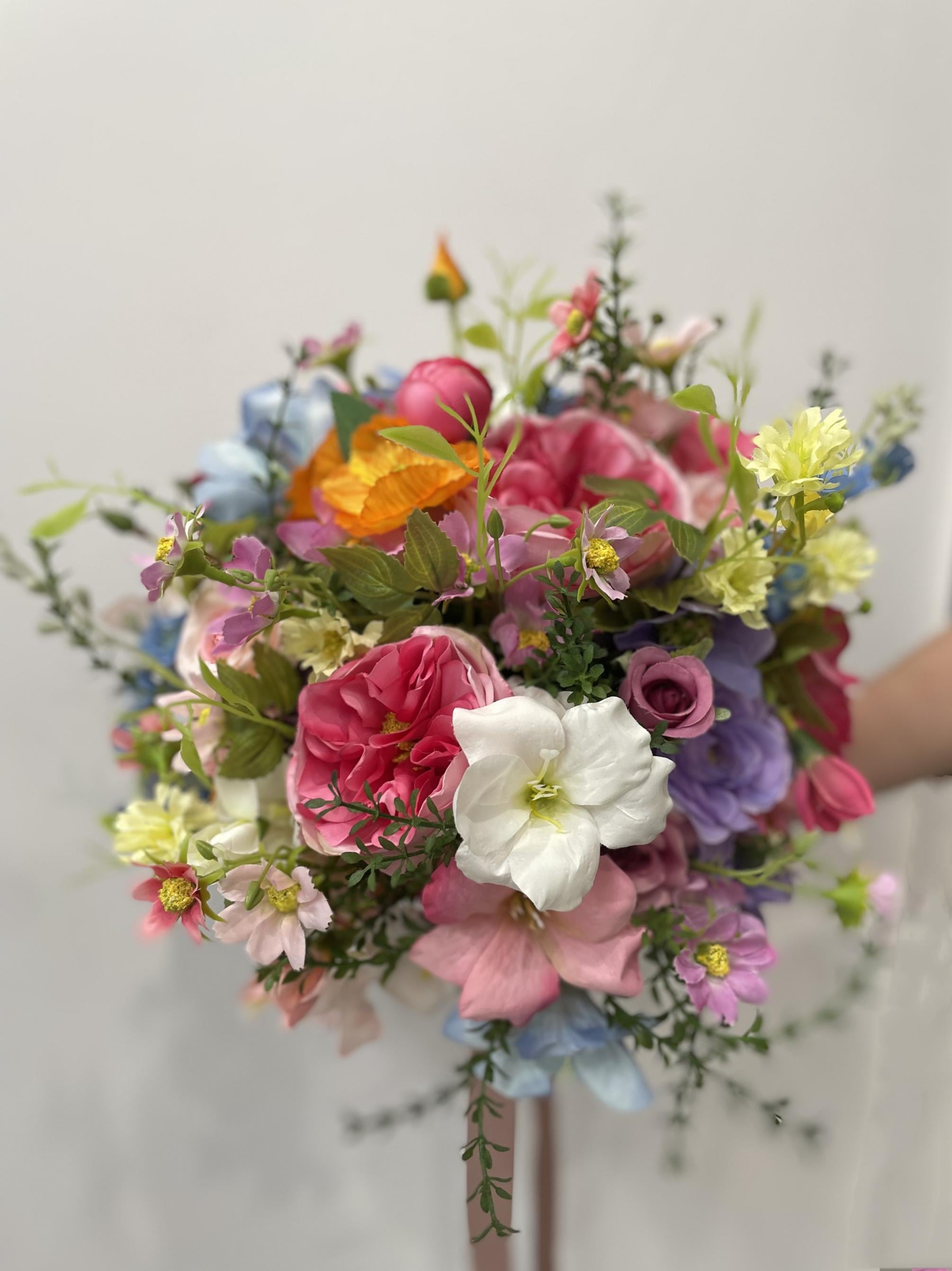 Pastel Wildflower Wedding Arbor Arrangements with Light Pink, Orange, Purple, and Blue Accents